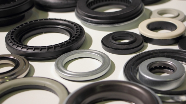 Blog 13 A many new o-rings and bearings on white table, car parts backgr